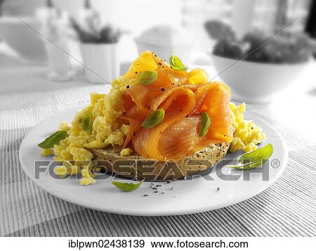 Smoked salmon scrambled eggs bagel View Large Photo Image Stock Photo - Smoked salmon scrambled eggs bagel. Fotosearch