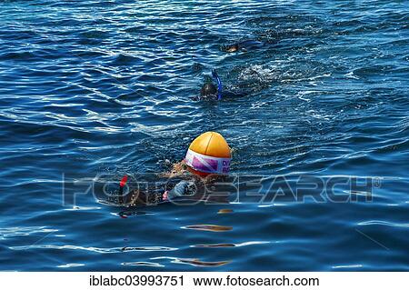 "Snorkeler with diving buoy, Wakatobi Dive Resort, Sulawesi, Indonesia, Asia" View Large Photo Image Stock Image - "Snorkeler with diving buoy, Wakatobi Dive Resort, Sulawesi, Indonesia, Asia". Fotosearch