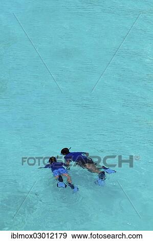 Stock Photo - "Snorkelers off a Maldivian island, Indian Ocean, Male, North Male Atoll, Maldives, Asia". Fotosearch