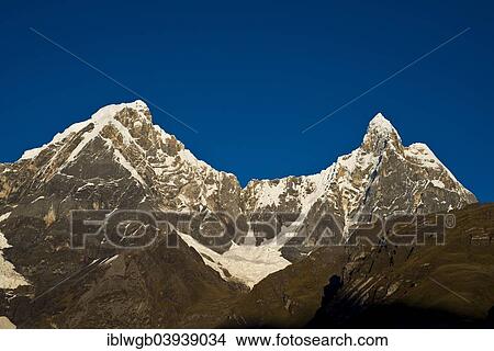 Picture - "Snow-capped mountains in the morning light, Yerupaja Chico, Jirishanca Grande, Cordillera Huayhuash range, Andes, northern Peru, Peru, South America". Fotosearch