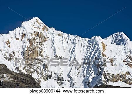 Picture - "Snow-capped Mt Nevados Jurau, Cordillera Huayhuash mountain range, Northern Peru, Peru, South America". Fotosearch