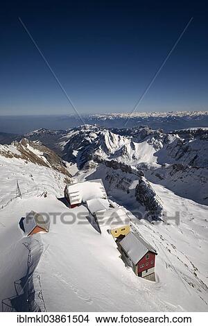 Picture - "Snow-covered mountain guest houses on Mt Santis, the Appenzell Alps at the back, Canton of Appenzell-Ausserrhoden, Switzerland, Europe". Fotosearch