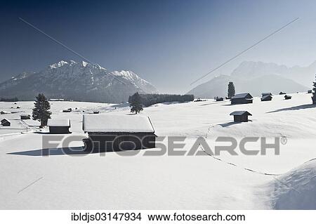 "Snow-covered pastures and hay barns, Wetterstein range at back, Mittenwald, Upper Bavaria, Bavaria, Germany, Europe" View Large Photo Image Picture - "Snow-covered pastures and hay barns, Wetterstein range at back, Mittenwald, Upper Bavaria, Bavaria, Germany, Europe". Fotosearch