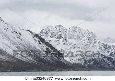 "Snow covered peaks in clouds, Smeerenburgfjorden, Spitsbergen Island, Svalbard Archipelago, Svalbard and Jan Mayen, Norway, Europe" View Large Photo Image Stock Photo - "Snow covered peaks in clouds, Smeerenburgfjorden, Spitsbergen Island, Svalbard Archipelago, Svalbard and Jan Mayen, Norway, Europe". Fotosearch