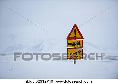 Stock Image - "Snow-covered warning sign indicating a ford in the winter landscape, Vatnajoekull Glacier, Icelandic Highlands, Iceland, Europe". Fotosearch