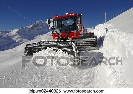 Stock Photography - "Snow groomer in winter in the mountains near Grindelwald First, Swiss Alps, Switzerland, Europe". Fotosearch