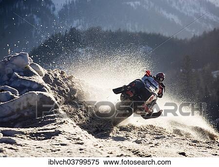 "Snow mobile or ski-doo rider jumping into a curve, Achenkirch, Achensee Lake or Lake Achen, North Tyrol, Austria, Europe" View Large Photo Image Stock Photography - "Snow mobile or ski-doo rider jumping into a curve, Achenkirch, Achensee Lake or Lake Achen, North Tyrol, Austria, Europe". Fotosearch