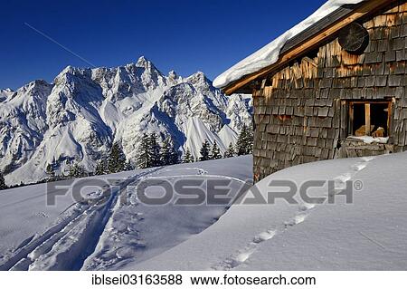 "Snowbound Vordere Uentschenalpe hut with a ski track and the peak of Mt Toblermannskopf, Baad, Kleinwalsertal, Vorarlberg, Austria, Europe" View Large Photo Image Stock Photo - "Snowbound Vordere Uentschenalpe hut with a ski track and the peak of Mt Toblermannskopf, Baad, Kleinwalsertal, Vorarlberg, Austria, Europe". Fotosearch