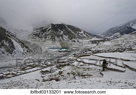 Stock Image - "Snowed in Marsyangdi Yuni valley above Manang, the gate to Thorong La Pass (5416 m), Manang, Annapurna Region, Nepal, Asia". Fotosearch