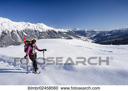 "Snowshoe hiker during the ascent to Jagelealm alpine pasture, overlooking Ridnauntal valley, Rosskopf Mountain and the Telfer Weissen Mountain, Alto Adige, Italy, Europe" View Large Photo Image Stock Image - "Snowshoe hiker during the ascent to Jagelealm alpine pasture, overlooking Ridnauntal valley, Rosskopf Mountain and the Telfer Weissen Mountain, Alto Adige, Italy, Europe". Fotosearch
