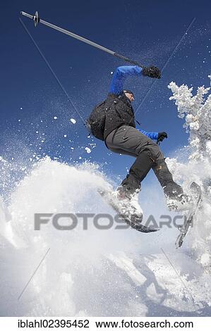 "Snowshoe hiker jumping, Hirschberg, Bavaria, Germany, Europe" View Large Photo Image Stock Image - "Snowshoe hiker jumping, Hirschberg, Bavaria, Germany, Europe". Fotosearch