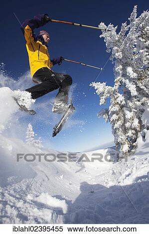 "Snowshoe hiker jumping, Hirschberg, Bavaria, Germany, Europe" View Large Photo Image Stock Photography - "Snowshoe hiker jumping, Hirschberg, Bavaria, Germany, Europe". Fotosearch