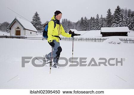 "Snowshoe hiker walking on a trail to Hoher Kranzberg mountain, Mittenwald, Bavaria, Germany, Europe" View Large Photo Image Stock Image - "Snowshoe hiker walking on a trail to Hoher Kranzberg mountain, Mittenwald, Bavaria, Germany, Europe". Fotosearch