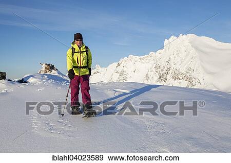 Stock Photo - "Snowshoe hikers on snowshoe tour on Tverrfjellet, Kvaloya, Mikkelvik, Troms, Norway, Europe". Fotosearch