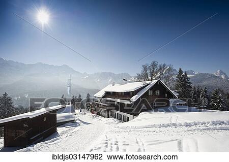 "Snowy landscape and mountain inn, Werdenfelser Land region at back, Eckbauer, Garmisch-Partenkirchen, Upper Bavaria, Bavaria, Germany, Europe" View Large Photo Image Stock Image - "Snowy landscape and mountain inn, Werdenfelser Land region at back, Eckbauer, Garmisch-Partenkirchen, Upper Bavaria, Bavaria, Germany, Europe". Fotosearch