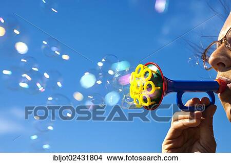 Soap bubbles from a bubble trumpet View Large Photo Image Picture - Soap bubbles from a bubble trumpet. Fotosearch