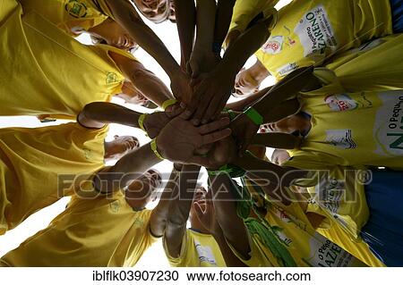 "Soccer team motivating themselves in a circle before a game, Street Children World Cup 2014, Rio de Janeiro, Rio de Janeiro State, Brazil, South America" View Large Photo Image Stock Image - "Soccer team motivating themselves in a circle before a game, Street Children World Cup 2014, Rio de Janeiro, Rio de Janeiro State, Brazil, South America". Fotosearch
