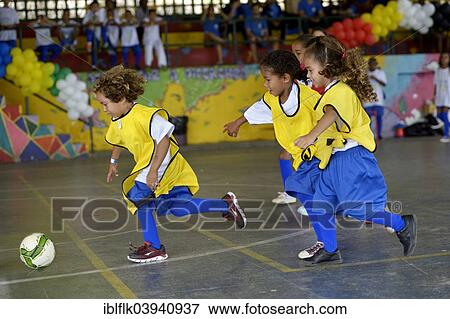 "Soccer tournament with children on the sports ground of a slum, Morro dos Prazeres favela, Rio de Janeiro, Brazil, South America" View Large Photo Image Stock Photo - "Soccer tournament with children on the sports ground of a slum, Morro dos Prazeres favela, Rio de Janeiro, Brazil, South America". Fotosearch