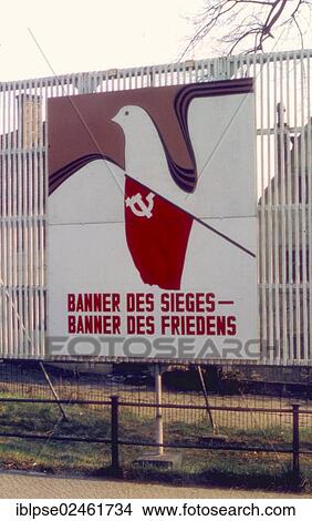 "Socialist propaganda sign, Banner des Sieges - Banner des Friedens, German for Banner of Victory - Banner of Peace, represented by a peace dove and the flag of the USSR, in April 1985, GDR, German Democratic Republic, Europe" View Large Photo Image Picture - "Socialist propaganda sign, Banner des Sieges - Banner des Friedens, German for Banner of Victory - Banner of Peace, represented by a peace dove and the flag of the USSR, in April 1985, GDR, German Democratic Republic, Europe". Fotosearch