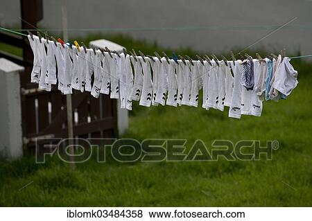 Stock Photo - "Socks hanging on a clothesline, Sumba, Suouroy, Faroe Islands, Denmark, Europe". Fotosearch