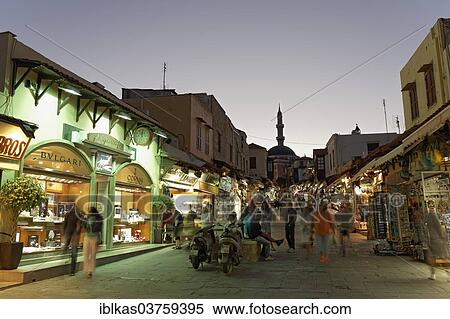 "Socrates Road or Odos Sokrates with jewellery stores and souvenir shops, at twilight, historic town centre, Rhodes, Island of Rhodes, Dodecanese, Greece, Europe" View Large Photo Image Stock Photography - "Socrates Road or Odos Sokrates with jewellery stores and souvenir shops, at twilight, historic town centre, Rhodes, Island of Rhodes, Dodecanese, Greece, Europe". Fotosearch