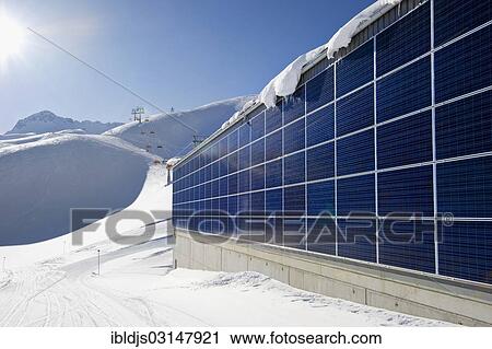 "Solar panel covered facade on the lift station, Zugspitze Mountain ski area, Zugspitze, Wetterstein mountain range, Eastern Alps, Upper Bavaria, Bavaria, Germany, Europe" View Large Photo Image Stock Image - "Solar panel covered facade on the lift station, Zugspitze Mountain ski area, Zugspitze, Wetterstein mountain range, Eastern Alps, Upper Bavaria, Bavaria, Germany, Europe". Fotosearch