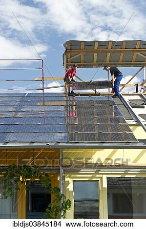 "Solar panels being installed on a roof, solar village in the Vauban quarter, Freiburg im Breisgau, Baden-Wurttemberg, Germany, Europe" View Large Photo Image Picture - "Solar panels being installed on a roof, solar village in the Vauban quarter, Freiburg im Breisgau, Baden-Wurttemberg, Germany, Europe". Fotosearch