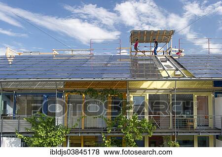 "Solar panels being installed on a roof, solar village in the Vauban quarter, Freiburg im Breisgau, Baden-Wurttemberg, Germany, Europe" View Large Photo Image Stock Photo - "Solar panels being installed on a roof, solar village in the Vauban quarter, Freiburg im Breisgau, Baden-Wurttemberg, Germany, Europe". Fotosearch