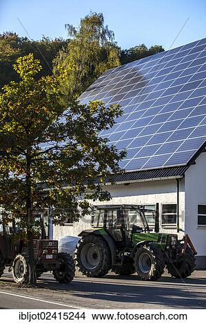 Solar panels on the roof of a barn, on a farm in Niedersorpe, North Rhine-Westphalia, Germany, Europe View Large Photo Image Picture - Solar panels on the roof of a barn, on a farm in Niedersorpe, North Rhine-Westphalia, Germany, Europe. Fotosearch