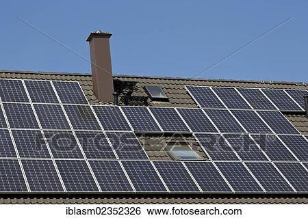 Solar panels on the roof of a private house View Large Photo Image Stock Photograph - Solar panels on the roof of a private house. Fotosearch