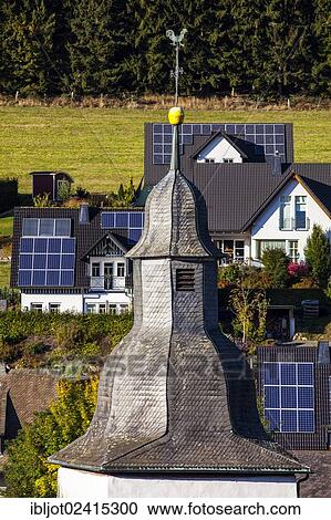 Solar panels on the roofs of residential houses, Oberkirchen, North Rhine-Westphalia, Germany, Europe View Large Photo Image Stock Image - Solar panels on the roofs of residential houses, Oberkirchen, North Rhine-Westphalia, Germany, Europe. Fotosearch