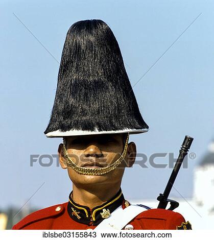 Stock Image - "Soldier wearing his uniform, Trooping the Colour on the birthday of King Bhumibol Adulyadej, Bangkok, Central Thailand, Thailand, Asia". Fotosearch