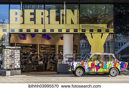 Stock Image - "Souvenir shop with colourful Trabant car at Alexanderplatz square, Berlin, Germany, Europe". Fotosearch