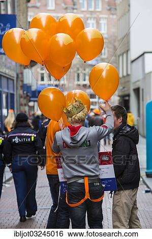 Stock Photograph - "Souvenir vendor on Queen's Day, celebrating the enthronement of King Willem-Alexander, Amsterdam, province of North Holland, The Netherlands, Europe". Fotosearch