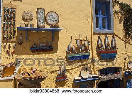 "Souvenirs displayed on a house wall, Oia, Santorini, Cyclades, Greece, Europe" View Large Photo Image Stock Photo - "Souvenirs displayed on a house wall, Oia, Santorini, Cyclades, Greece, Europe". Fotosearch