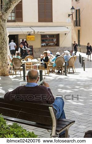 Spaniard reading a newspaper on Placa de Santa Eulalia square, historic town centre, Palma de Majorca, Majorca, Balearic Islands, Spain, Europe View Large Photo Image Stock Photograph - Spaniard reading a newspaper on Placa de Santa Eulalia square, historic town centre, Palma de Majorca, Majorca, Balearic Islands, Spain, Europe. Fotosearch