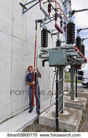 "Special engineer during outdoor work at a substation of transmission network operator 50Hertz, Bad Lauchstadt, Saxony-Anhalt, Germany, Europe" View Large Photo Image Stock Image - "Special engineer during outdoor work at a substation of transmission network operator 50Hertz, Bad Lauchstadt, Saxony-Anhalt, Germany, Europe". Fotosearch