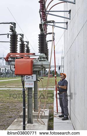 "Special engineer during outdoor work at a substation of transmission network operator 50Hertz, Bad Lauchstadt, Saxony-Anhalt, Germany, Europe" View Large Photo Image Stock Image - "Special engineer during outdoor work at a substation of transmission network operator 50Hertz, Bad Lauchstadt, Saxony-Anhalt, Germany, Europe". Fotosearch