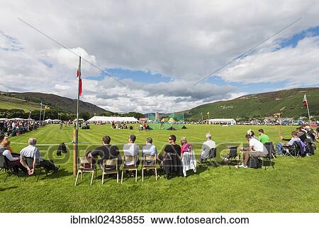 Stock Photography - "Spectators sitting on the sidelines, Helmsdale Highland Games, Helmsdale, Sutherland, Scotland, United Kingdom, Europe". Fotosearch