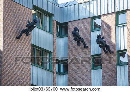 "Spezialeinsatzkommandos, SEK, the special response unit of the German state police forces, abseiling down a wall, exercise of the NRW Police special task forces, North Rhine-Westphalia, Germany, Europe" View Large Photo Image Stock Image - "Spezialeinsatzkommandos, SEK, the special response unit of the German state police forces, abseiling down a wall, exercise of the NRW Police special task forces, North Rhine-Westphalia, Germany, Europe". Fotosearch