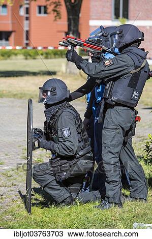 "Spezialeinsatzkommandos, SEK, the special response unit of the German state police forces, using weapons not capable of shooting, marked red, during an exercise of the NRW Police special task forces, North Rhine-Westphalia, Germany, Europe" View Large Photo Image Stock Image - "Spezialeinsatzkommandos, SEK, the special response unit of the German state police forces, using weapons not capable of shooting, marked red, during an exercise of the NRW Police special task forces, North Rhine-Westphalia, Germany, Europe". Fotosearch