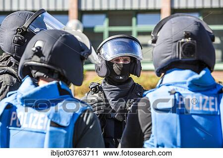 "Spezialeinsatzkommandos, SEK, the special response unit of the German state police forces, wearing blue safety vests during an exercise of the NRW Police special task forces, North Rhine-Westphalia, Germany, Europe" View Large Photo Image Stock Image - "Spezialeinsatzkommandos, SEK, the special response unit of the German state police forces, wearing blue safety vests during an exercise of the NRW Police special task forces, North Rhine-Westphalia, Germany, Europe". Fotosearch