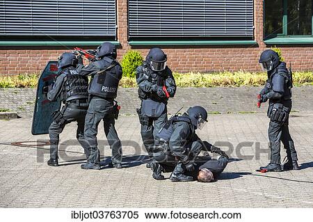 "Spezialeinsatzkommandos, SEK, the special response unit of the German state police forces, using weapons not capable of shooting, marked red, during an exercise of the NRW Police special task forces, North Rhine-Westphalia, Germany, Europe" View Large Photo Image Stock Photography - "Spezialeinsatzkommandos, SEK, the special response unit of the German state police forces, using weapons not capable of shooting, marked red, during an exercise of the NRW Police special task forces, North Rhine-Westphalia, Germany, Europe". Fotosearch