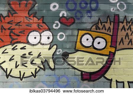 "Spiny fish figure kissing a hedgehog figure wearing goggles, mural, North Rhine-Westphalia, Germany, Europe" View Large Photo Image Stock Photograph - "Spiny fish figure kissing a hedgehog figure wearing goggles, mural, North Rhine-Westphalia, Germany, Europe". Fotosearch