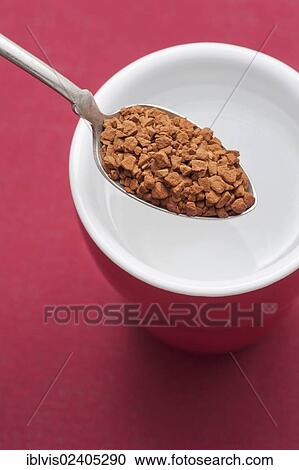 Spoon with instant coffee and cup filled with hot water View Large Photo Image Stock Image - Spoon with instant coffee and cup filled with hot water. Fotosearch