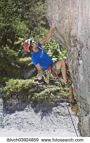 "Sport climber wearing a helmet climbing a rock face, Ehnbachklamm gorge, Zirl, Tyrol, Austria, Europe" View Large Photo Image Stock Photo - "Sport climber wearing a helmet climbing a rock face, Ehnbachklamm gorge, Zirl, Tyrol, Austria, Europe". Fotosearch