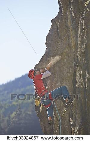 Stock Photo - "Sport climber wearing a helmet climbing a rock face, Ehnbachklamm gorge, Zirl, Tyrol, Austria, Europe". Fotosearch