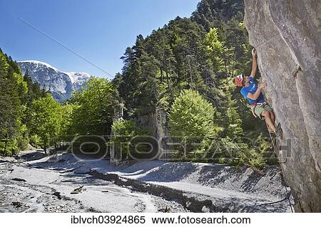 "Sport climber wearing a helmet climbing a rock face, Ehnbachklamm gorge, Zirl, Tyrol, Austria, Europe" View Large Photo Image Stock Photography - "Sport climber wearing a helmet climbing a rock face, Ehnbachklamm gorge, Zirl, Tyrol, Austria, Europe". Fotosearch