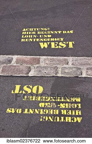 "Sprayed words """"Achtung! Hier beginnt das Lohn- und Rentengebiet Ost, West"""" or """"Warning! Here begins the wage and pension area east, west"""", former Berlin Wall, Potsdamer Platz, Berlin, Germany, Europe" View Large Photo Image Stock Image - "Sprayed words """"Achtung! Hier beginnt das Lohn- und Rentengebiet Ost, West"""" or """"Warning! Here begins the wage and pension area east, west"""", former Berlin Wall, Potsdamer Platz, Berlin, Germany, Europe". Fotosearch
