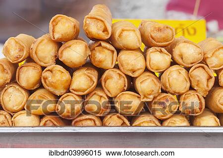 Stock Photography - "Spring rolls on sale at a market, Thailand, Asia". Fotosearch